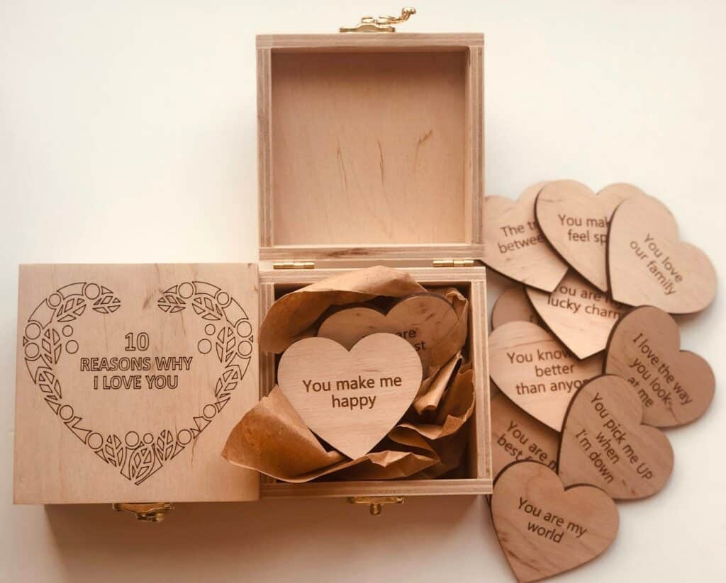 A wooden box says "10 Reasons Why I Love You."